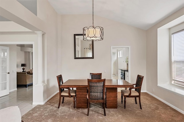 7960 Hampton Ct, University Park, FL 34201 - tiled dining room featuring ornate columns, lofted ceiling, and carpet