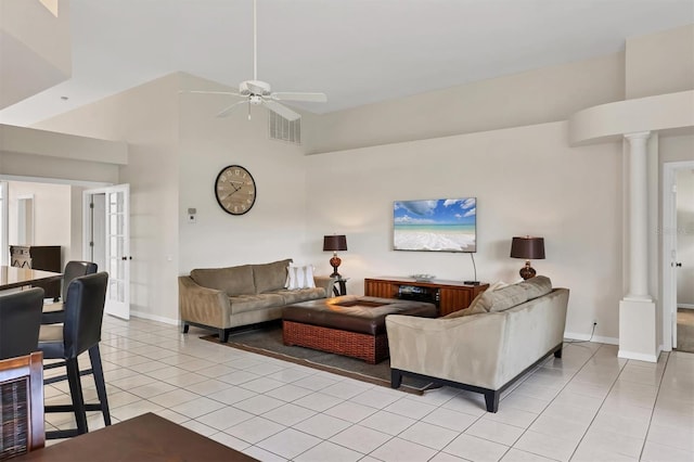 7960 Hampton Ct, University Park, FL 34201 - living area with light tile patterned floors, ceiling fan, high vaulted ceiling, and decorative columns