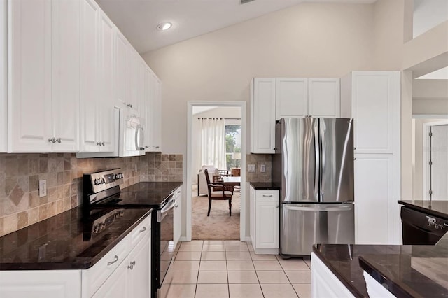 7960 Hampton Ct, University Park, FL 34201 - kitchen featuring electric stove, freestanding refrigerator, dishwasher, light tile patterned floors, and high vaulted ceiling