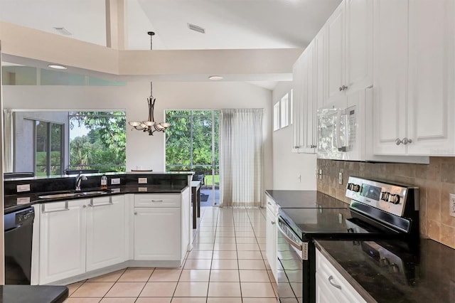 7960 Hampton Ct, University Park, FL 34201 - kitchen featuring electric range, white microwave, dishwasher, lofted ceiling, and tasteful backsplash