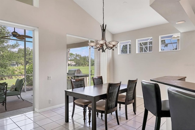 7960 Hampton Ct, University Park, FL 34201 - dining room with a chandelier, plenty of natural light, light tile patterned floors, high vaulted ceiling, and ceiling fan