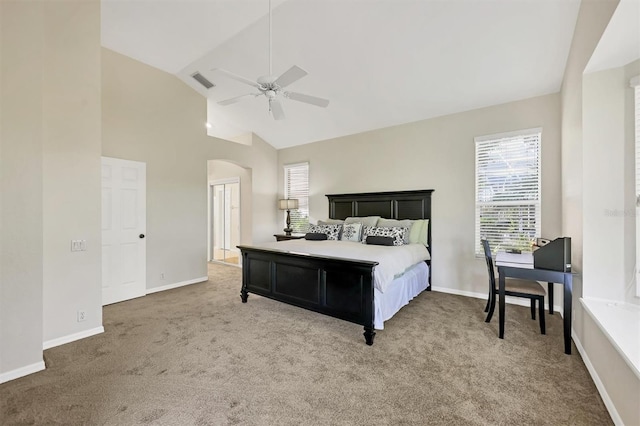7960 Hampton Ct, University Park, FL 34201 - carpeted bedroom with arched walkways, a ceiling fan, and high vaulted ceiling