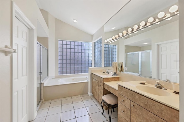 7960 Hampton Ct, University Park, FL 34201 - bathroom with a stall shower, vanity, a bath, lofted ceiling, and tile patterned flooring