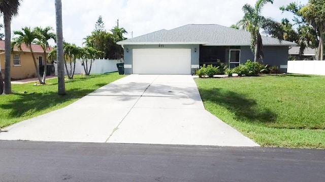 671 E Baffin Dr, Venice, FL 34293 - single story home with an attached garage, driveway, and stucco siding