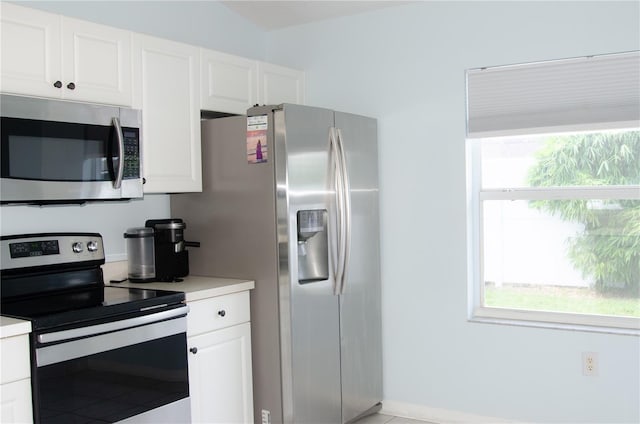 671 E Baffin Dr, Venice, FL 34293 - kitchen featuring stainless steel appliances, plenty of natural light, and white cabinetry