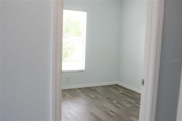 671 E Baffin Dr, Venice, FL 34293 - spare room featuring wood finished floors and healthy amount of natural light