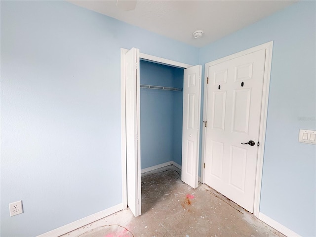 671 E Baffin Dr, Venice, FL 34293 - unfurnished bedroom with concrete floors and a closet