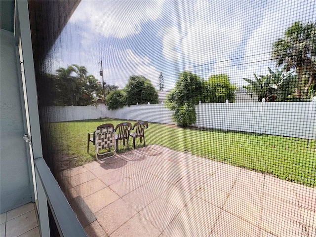 671 E Baffin Dr, Venice, FL 34293 - fenced backyard with a patio area
