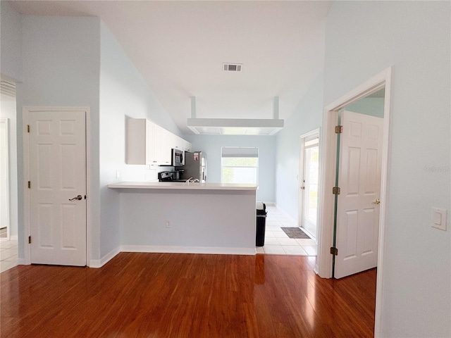 671 E Baffin Dr, Venice, FL 34293 - hall featuring light wood-type flooring and vaulted ceiling