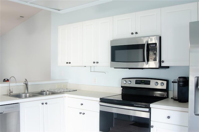 671 E Baffin Dr, Venice, FL 34293 - kitchen featuring stainless steel appliances, light countertops, and white cabinetry