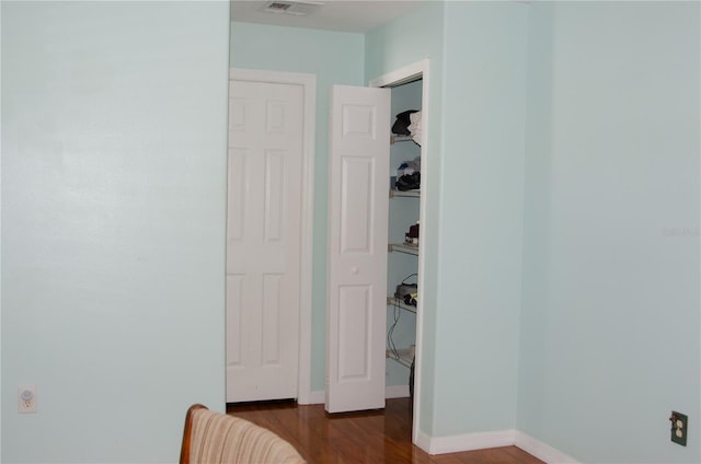 671 E Baffin Dr, Venice, FL 34293 - corridor featuring dark wood-style floors and baseboards