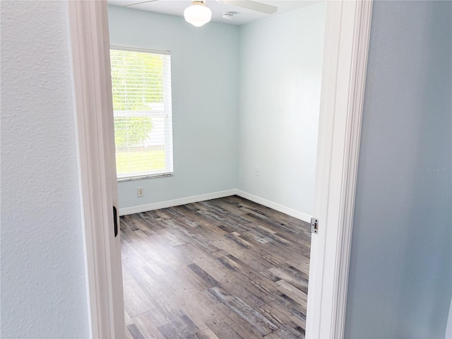 671 E Baffin Dr, Venice, FL 34293 - empty room with wood finished floors, ceiling fan, and a smoke detector