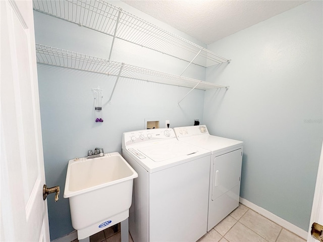 671 E Baffin Dr, Venice, FL 34293 - washroom featuring washing machine and clothes dryer and light tile patterned floors