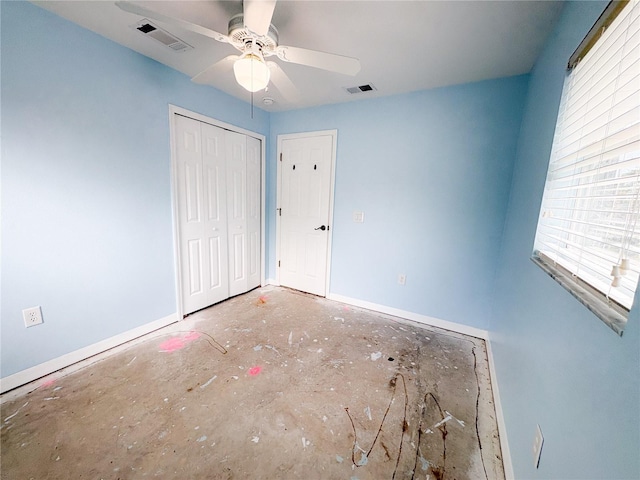671 E Baffin Dr, Venice, FL 34293 - unfurnished bedroom with multiple windows, a closet, and a ceiling fan
