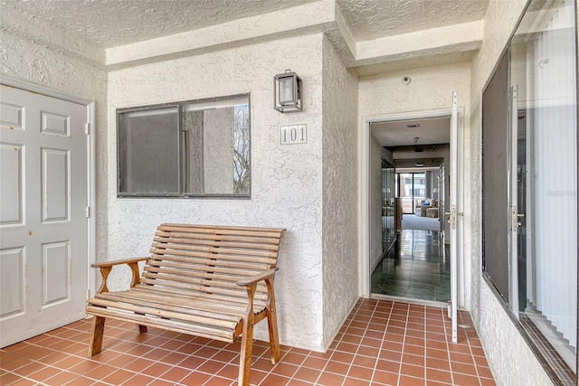 1485 Gulf Of Mexico Dr Unit 101, Longboat Key, FL 34228 - view of exterior entry featuring stucco siding