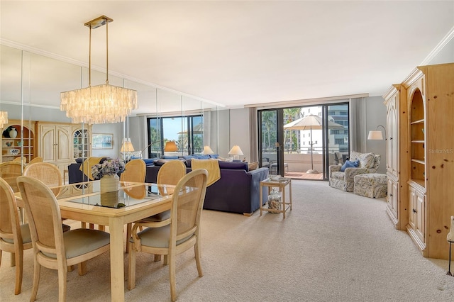 1485 Gulf Of Mexico Dr Unit 101, Longboat Key, FL 34228 - dining space featuring light carpet, ornamental molding, and a chandelier
