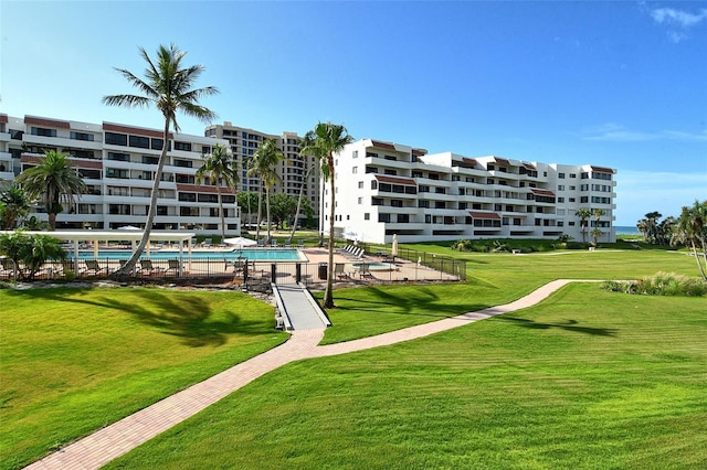 1485 Gulf Of Mexico Dr Unit 101, Longboat Key, FL 34228 - view of community with a swimming pool and a yard