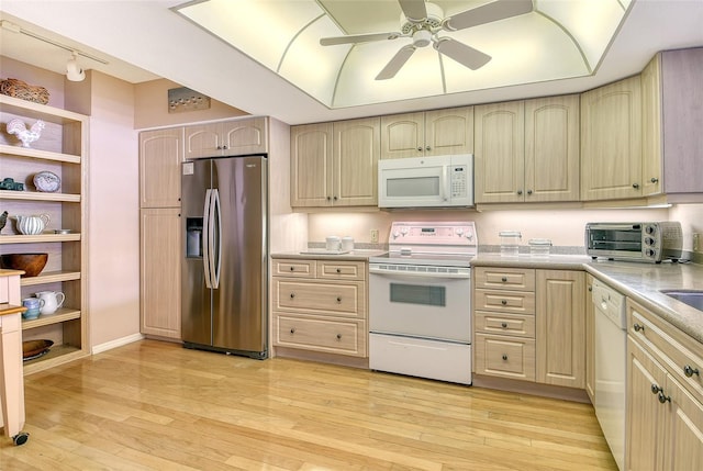 1485 Gulf Of Mexico Dr Unit 101, Longboat Key, FL 34228 - kitchen with white appliances, a ceiling fan, light countertops, and light wood-style flooring