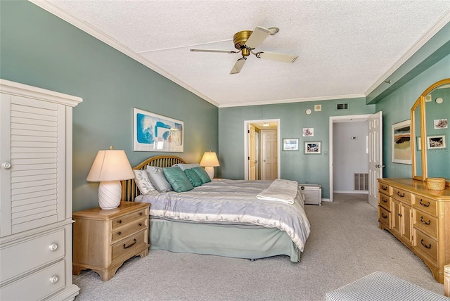1485 Gulf Of Mexico Dr Unit 101, Longboat Key, FL 34228 - bedroom with light colored carpet, a textured ceiling, crown molding, and a ceiling fan