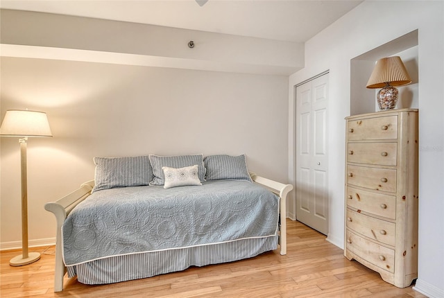 1485 Gulf Of Mexico Dr Unit 101, Longboat Key, FL 34228 - bedroom with light wood-type flooring and a closet