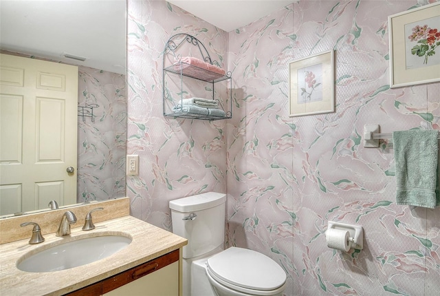 1485 Gulf Of Mexico Dr Unit 101, Longboat Key, FL 34228 - bathroom featuring vanity and wallpapered walls
