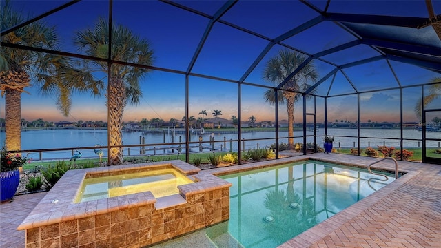 1114 Bearing Ct, Bradenton, FL 34208 - pool at dusk with an in-ground hot tub, a water view, an outdoor pool, and a dock