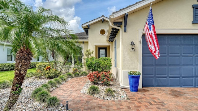 1114 Bearing Ct, Bradenton, FL 34208 - view of front of property featuring stucco siding and an attached garage
