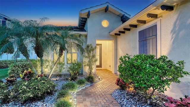 1114 Bearing Ct, Bradenton, FL 34208 - doorway to property featuring stucco siding