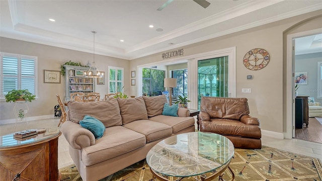 1114 Bearing Ct, Bradenton, FL 34208 - living area with a raised ceiling, plenty of natural light, recessed lighting, a chandelier, and ornamental molding