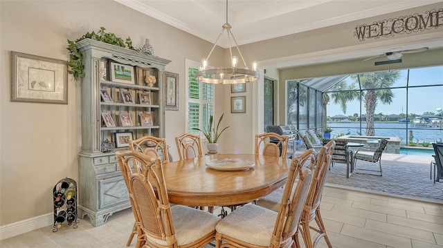 1114 Bearing Ct, Bradenton, FL 34208 - dining room featuring a sunroom, a chandelier, a ceiling fan, light tile patterned floors, and a water view