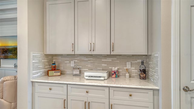 1114 Bearing Ct, Bradenton, FL 34208 - kitchen with tasteful backsplash and white cabinets