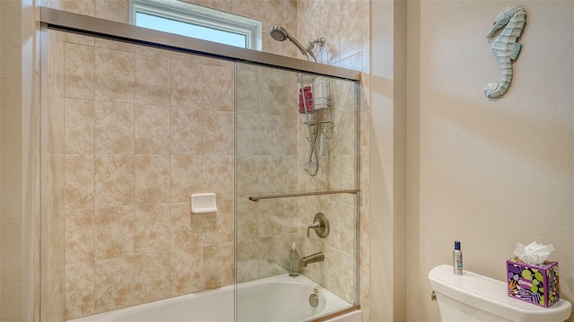 1114 Bearing Ct, Bradenton, FL 34208 - bathroom featuring toilet and combined bath / shower with glass door
