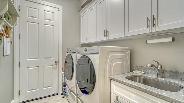 1114 Bearing Ct, Bradenton, FL 34208 - laundry area with washer and dryer and cabinet space