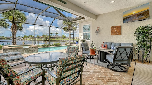 1114 Bearing Ct, Bradenton, FL 34208 - view of patio / terrace with an in-ground hot tub, an outdoor pool, a water view, and glass enclosure