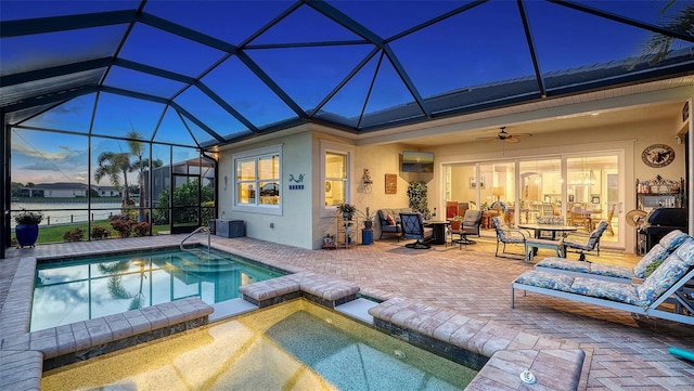 1114 Bearing Ct, Bradenton, FL 34208 - view of swimming pool featuring a patio area, a lanai, ceiling fan, and a pool with connected hot tub