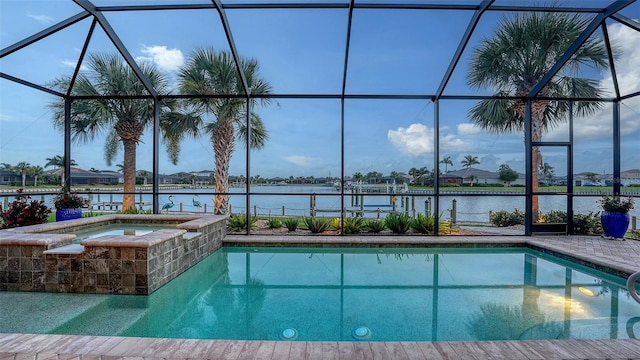 1114 Bearing Ct, Bradenton, FL 34208 - outdoor pool with glass enclosure, an in-ground hot tub, and a water view