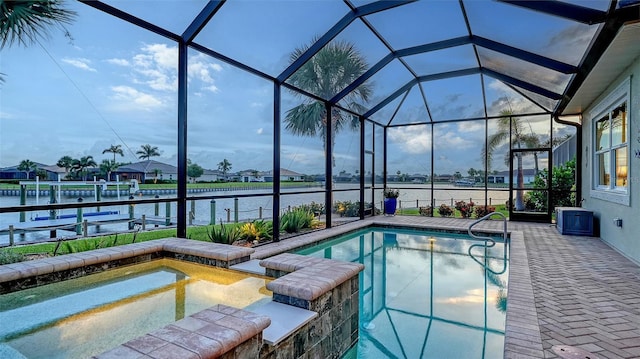 1114 Bearing Ct, Bradenton, FL 34208 - view of swimming pool featuring a boat dock, a water view, boat lift, and glass enclosure