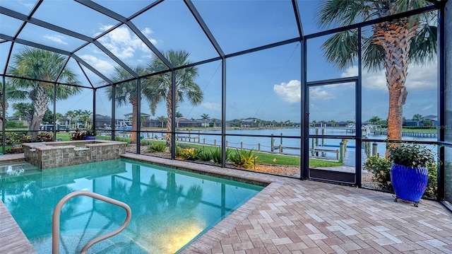 1114 Bearing Ct, Bradenton, FL 34208 - view of pool featuring a water view, a lanai, a pool with connected hot tub, and a patio