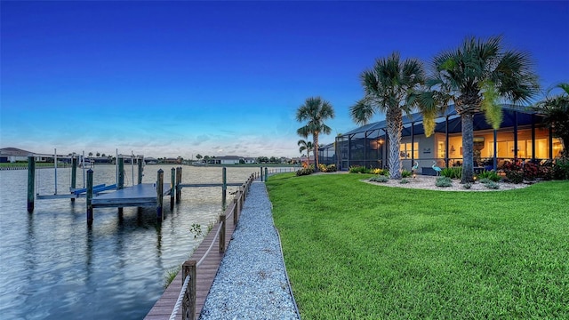 1114 Bearing Ct, Bradenton, FL 34208 - dock with boat lift, a lawn, and a water view