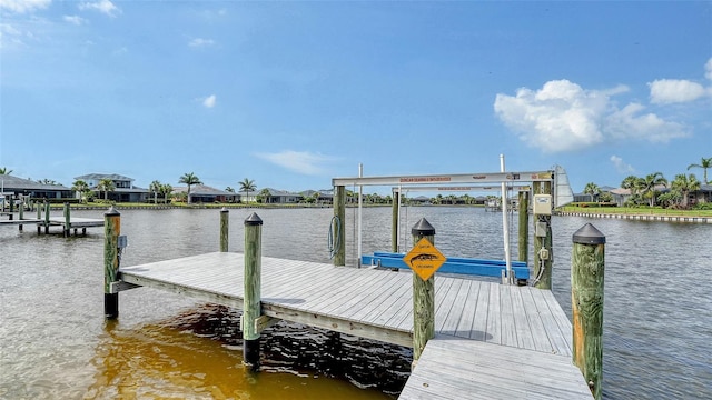 1114 Bearing Ct, Bradenton, FL 34208 - dock featuring a water view, boat lift, and a residential view