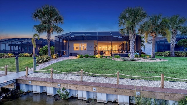 1114 Bearing Ct, Bradenton, FL 34208 - rear view of property featuring a yard and a lanai