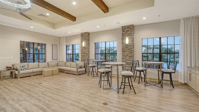 1114 Bearing Ct, Bradenton, FL 34208 - living room featuring beam ceiling, recessed lighting, light wood finished floors, plenty of natural light, and a high ceiling