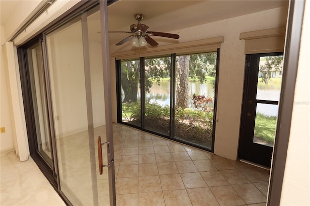 3376 Sandleheath Unit 9, Sarasota, FL 34235 - unfurnished sunroom featuring a water view and tile patterned floors