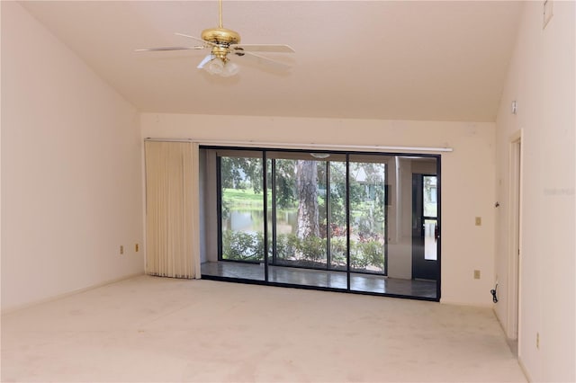 3376 Sandleheath Unit 9, Sarasota, FL 34235 - carpeted spare room featuring healthy amount of natural light, lofted ceiling, and ceiling fan