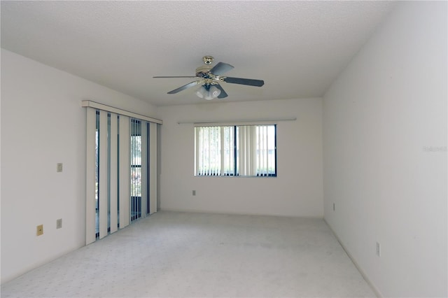 3376 Sandleheath Unit 9, Sarasota, FL 34235 - empty room with carpet floors and ceiling fan