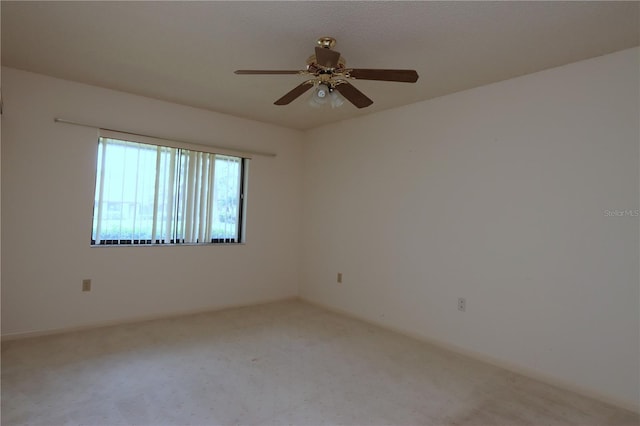 3376 Sandleheath Unit 9, Sarasota, FL 34235 - spare room with carpet flooring and a ceiling fan