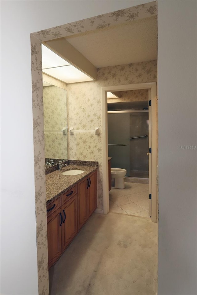 3376 Sandleheath Unit 9, Sarasota, FL 34235 - bathroom with a shower with shower door and vanity