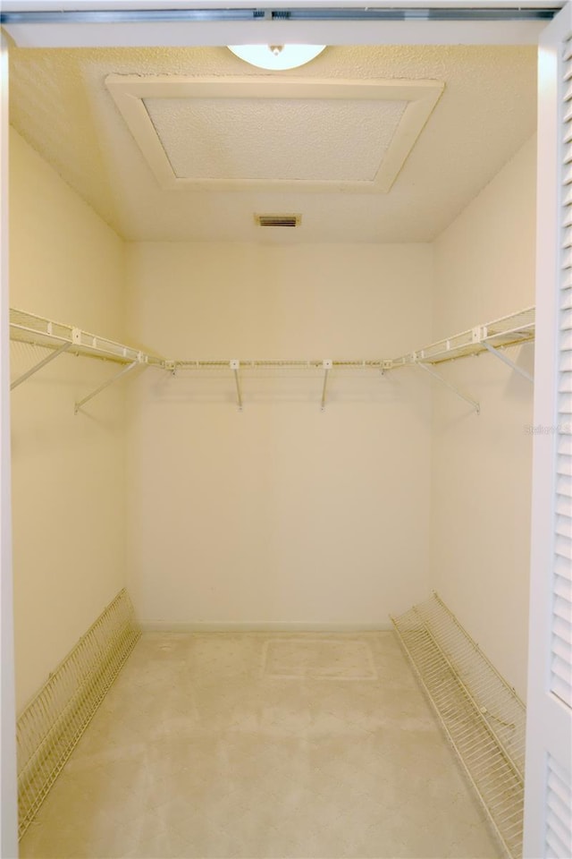 3376 Sandleheath Unit 9, Sarasota, FL 34235 - spacious closet featuring attic access