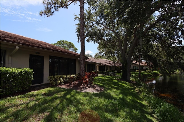 3376 Sandleheath Unit 9, Sarasota, FL 34235 - view of grassy yard