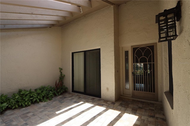 3376 Sandleheath Unit 9, Sarasota, FL 34235 - view of exterior entry with stucco siding